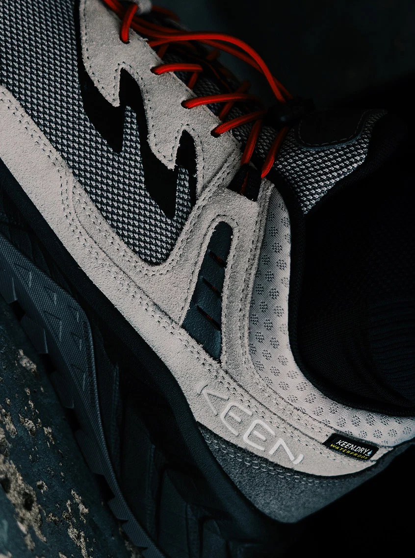 Product shot of Bal and Keen collaboration Hightrail shoe showcasing red bungee laces.